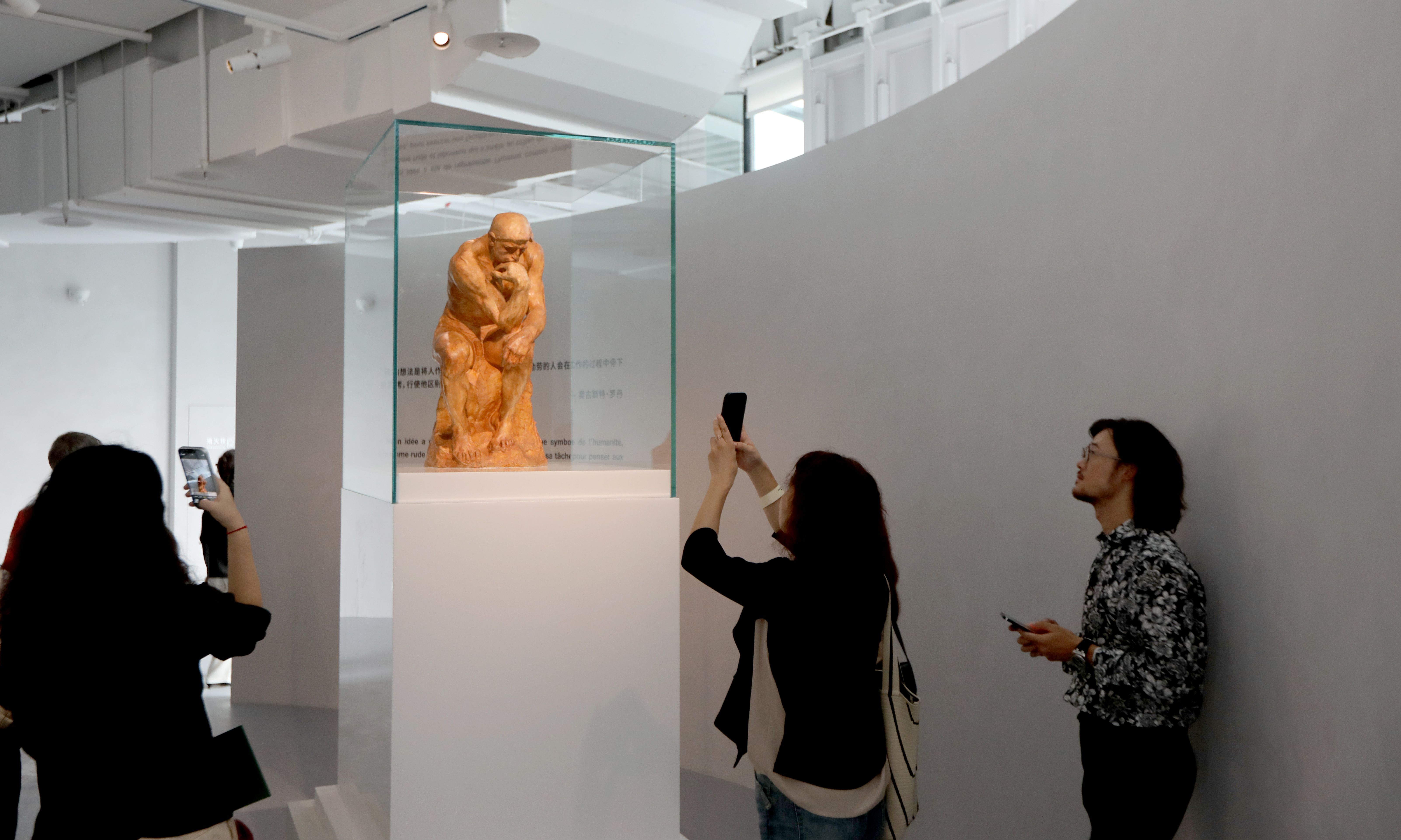 Visitors take photos of an original size version of The Thinker, an emblematic work of Auguste Rodin, at a preview of exhibition Rodin: A Hinge Figure towards Modernity in Shanghai on September 27, 2024. (Photo: Chen Xia/GT)